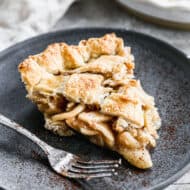 A slice of easy homemade Apple Pie on a plate with a fork.